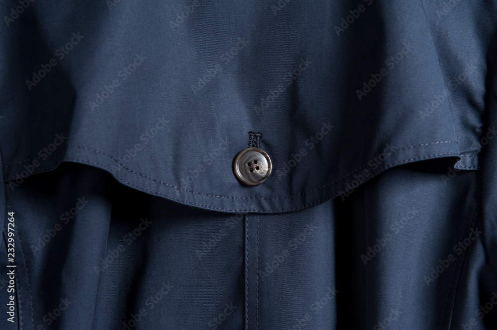 Partial close-up of buttons in dark clothes Partial close-up of buttons in dark clothes