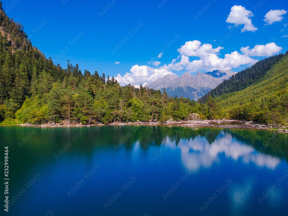 Baduk lakes from the height of the quadrocopter in summer, Alpine lakes among the mountains with forest