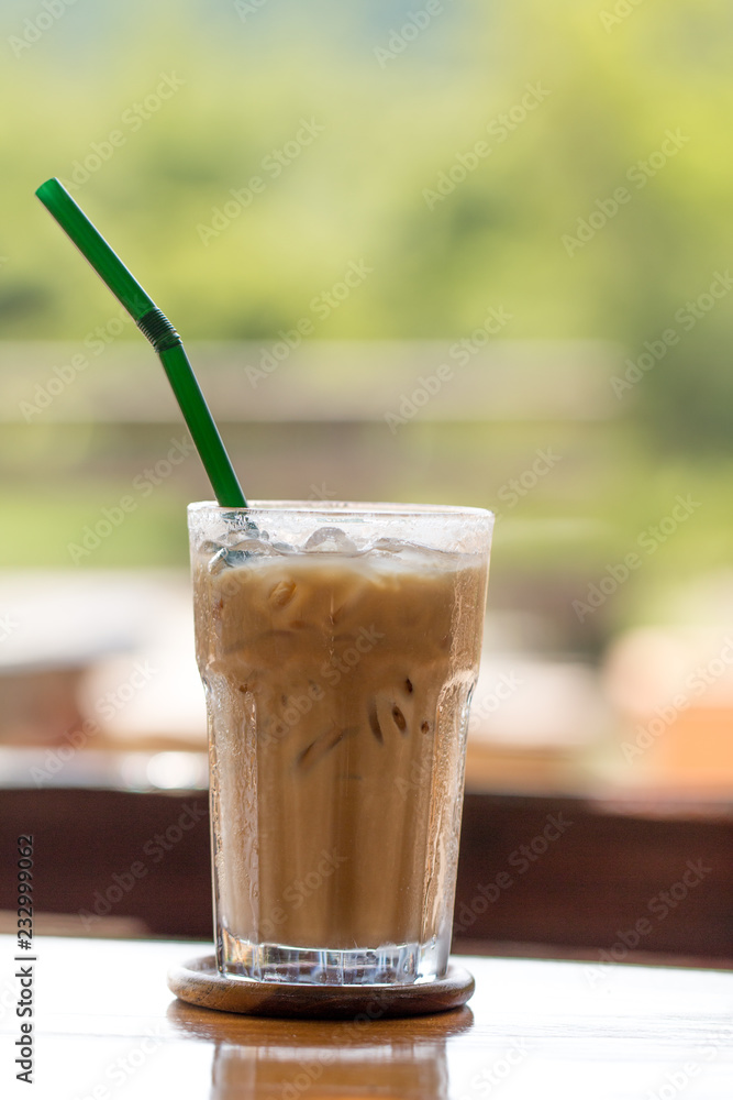 Iced chocolate on outdoor wood desk background Iced chocolate on outdoor wood desk background