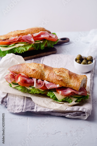 Φωτογραφία Side view of two fresh baguette sandwiches bahn-mi styled