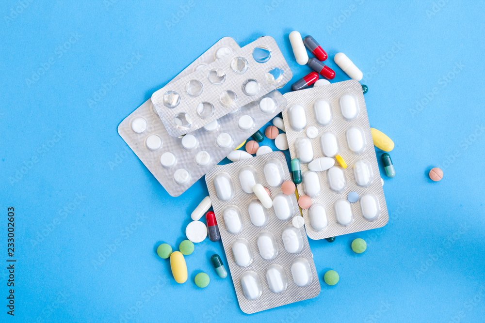 Various medications, medicine and tablets, blue background Various medications, medicine and tablets, blue background