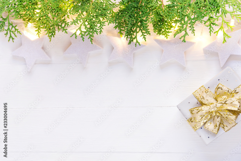 Beautiful elegant Christmas New Year background. White stars sparkling  golden lights garland green juniper gift box on plank wood. Upper border. High  resolution banner poster placeholder Stock Photo | Adobe Stock