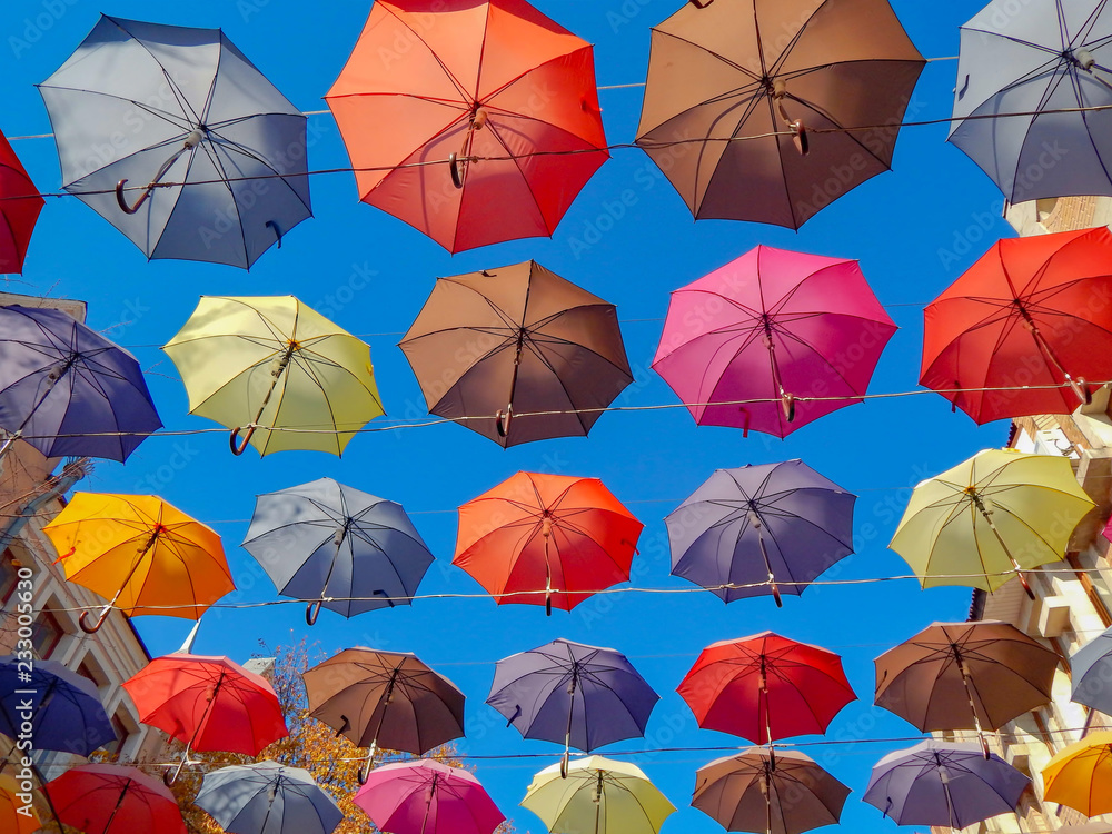 colorful umbrellas soaring hanging in the blue sky colorful umbrellas soaring hanging in the blue sky