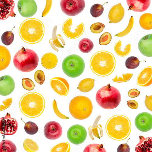 Creative flat layout of fruit  top view. Sliced orange  lemon  plum  banana  pomegranate  apple isolated on white background. Food wallpaper  composition pattern of fresh fruits.