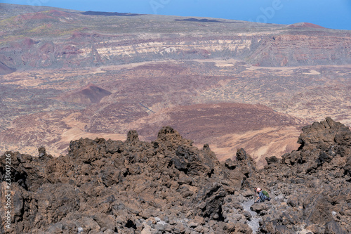 Hikers overlook the volcano's crater at Altavista Refuge, near the summit of Mount Teide photo