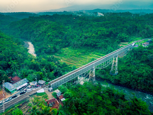 Scenic Aerial View of Cirahong Bridge, A Double Deck Structure of Metal Railway Bridge and Car Bridge Underneath Made by Dutch Colonial, Manonjaya Tasikmalaya, West Java Indonesia, Asia