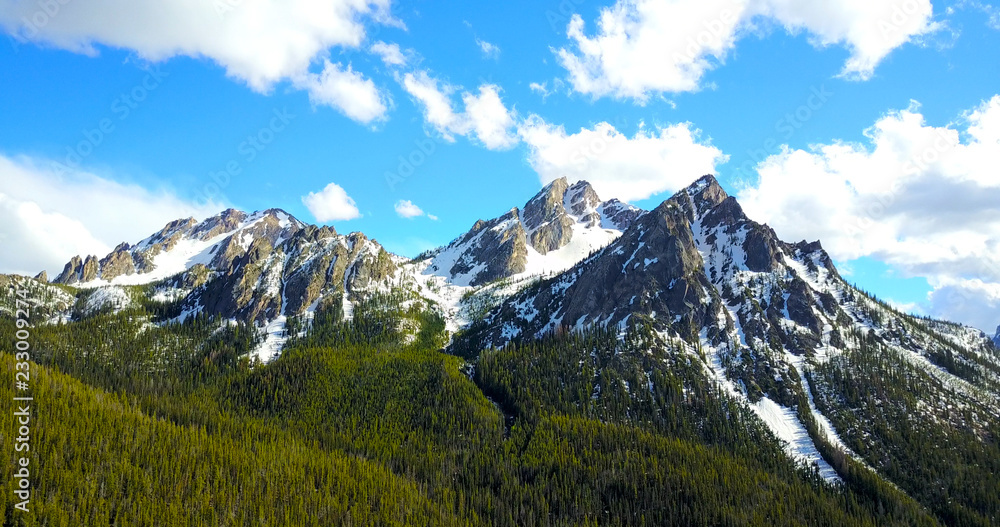 Sawtooth Mountains Idaho - Drone Aerial View Of Jagged Snowy Peaks With Pine Trees On The Slopes