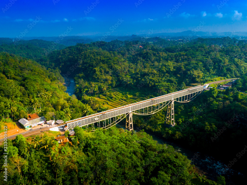 Scenic Aerial View of Cirahong Bridge, A Double Deck Structure of Metal Railway Bridge and Car Bridge Underneath Made by Dutch Colonial, Manonjaya Tasikmalaya, West Java Indonesia, Asia Scenic Aerial View of Cirahong Bridge, A Double Deck Structure of Metal Railway Bridge and Car Bridge Underneath Made by Dutch Colonial, Manonjaya Tasikmalaya, West Java Indonesia, Asia