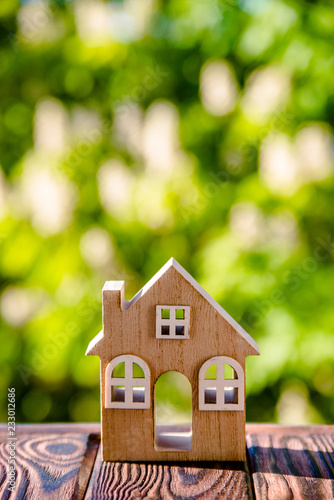 The symbol of the house on a natural green background 