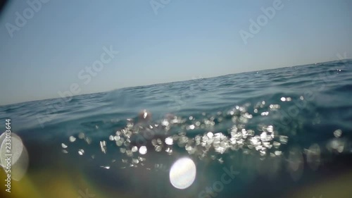 A hand in the water calling for help. Someone is drowning in the sea. Save a man. Slow motion video.