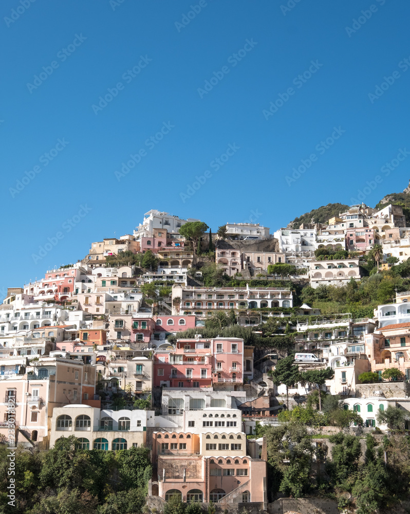 Colourful houses on the mountain side in the delightful town of Positano on the Amalfi Coast in Southern Italy. Photographed on a clear day in early autumn.