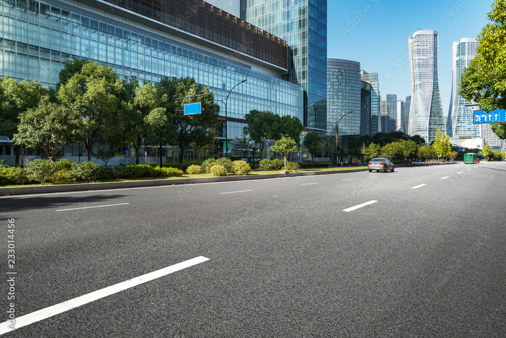 Empty road floor surface with modern city landmark buildings of hangzhou bund Skyline，zhejiang,china