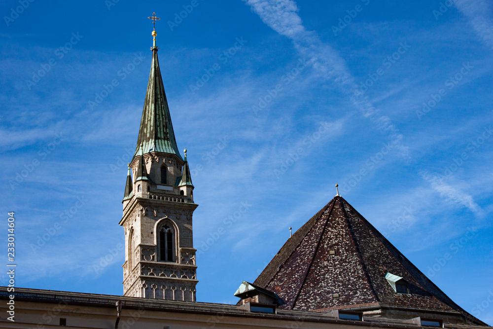 Obraz premium Tower of Franciscan Church against blue sky. Salzburg, Austria.