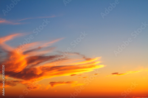 beautiful sunset clouds in the sky over the sea, bright colors of sunset