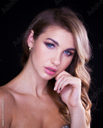 Closeup portrait of beautiful model with long blond hair