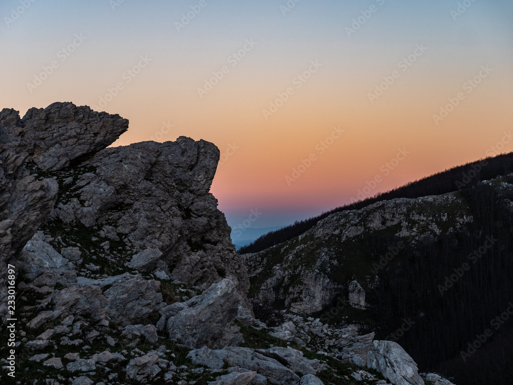 limestone rocks in backlight at sunset in the Matese mountains, Campania and Molise, Italy