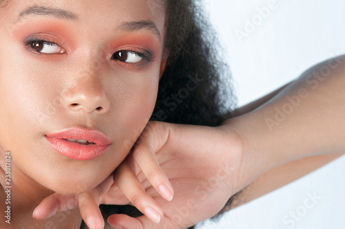 Young beautiful black girl with clean perfect skin close-up