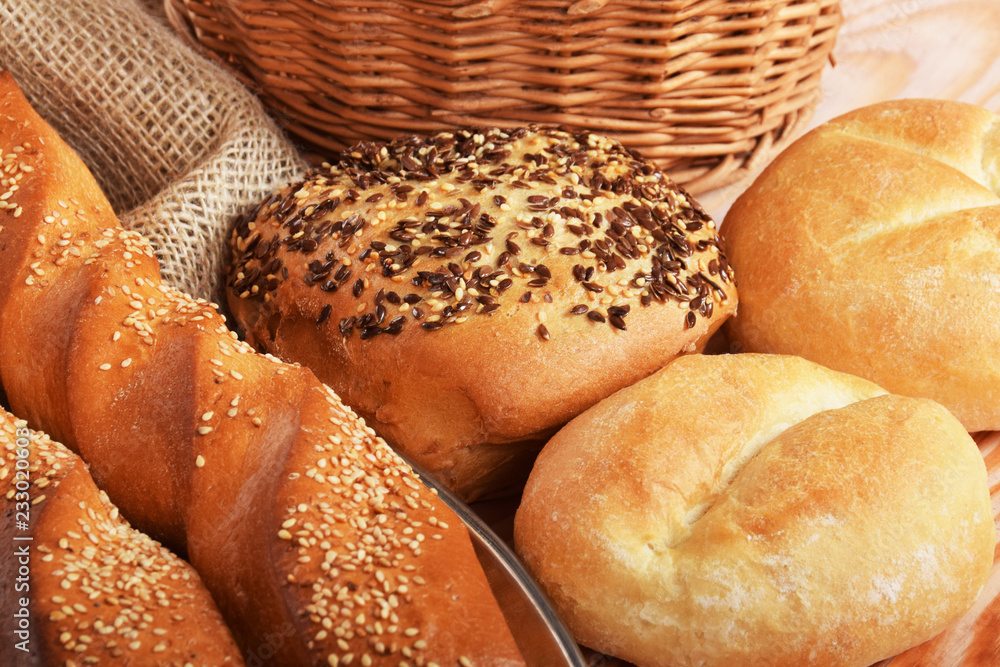 baguettes with sesame seeds, butter buns and a roll with linseed