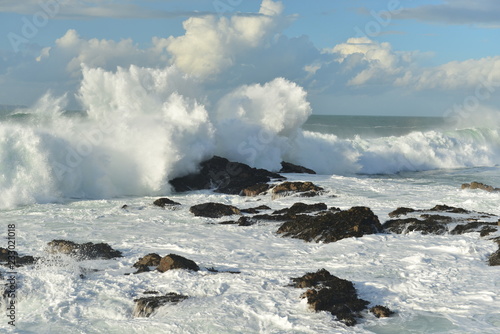 Plemont, Jersey, U.K. An Oceanic wave pounds the coastline.
