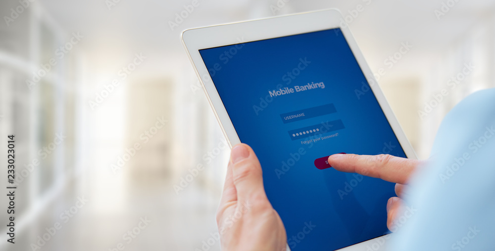 Close up of a male hands holds a tablet with online banking