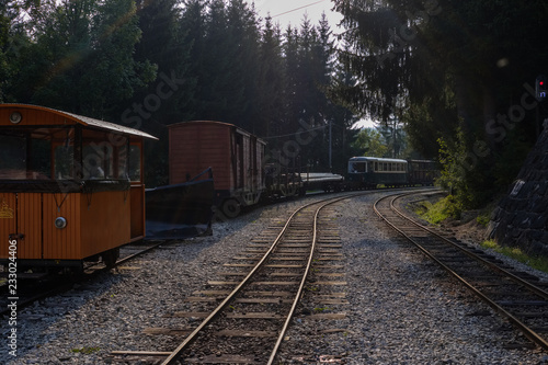 ancient log wood railway and train on the tracks