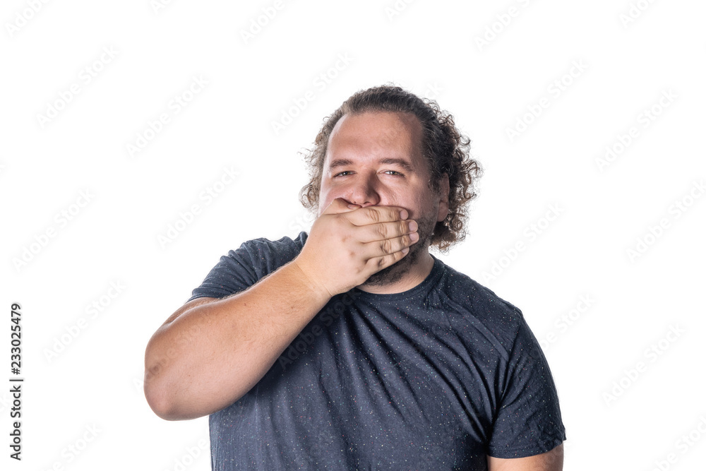 Portrait of amazed man covering his mouth over white background. Say no evil concept Portrait of amazed man covering his mouth over white background. Say no evil concept