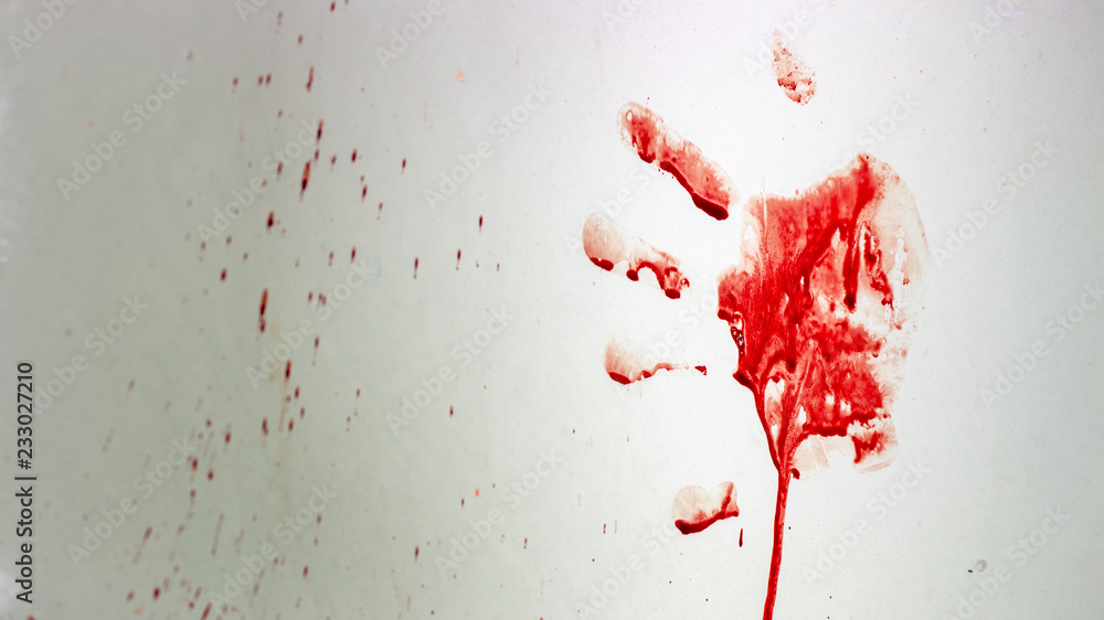 Red imprint of the bloody palm on a white background