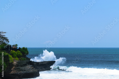 Landscape of huge white Indian ocean wave splash to to the cliff in Bali, Indonesia