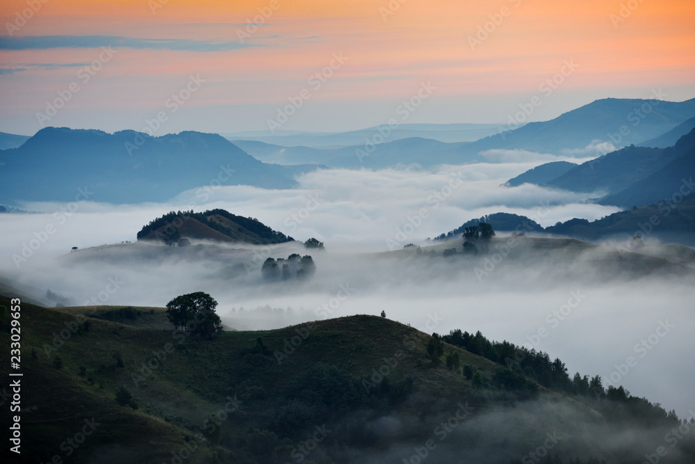 mountain landscape with autumn morning fog
