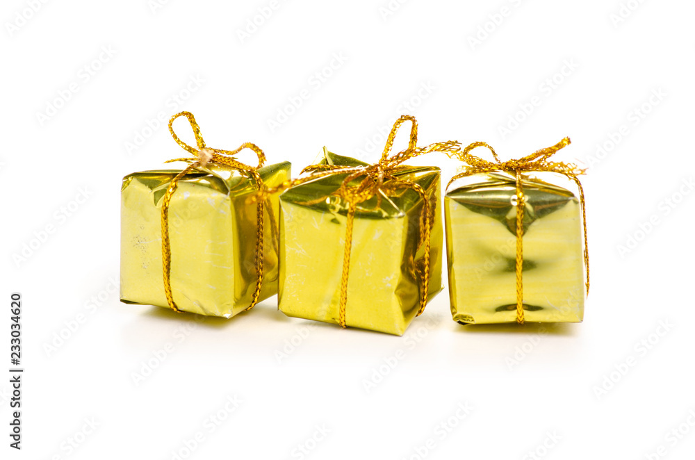 Christmas toys golden gifts box on a white background. Isolation Christmas toys golden gifts box on a white background. Isolation