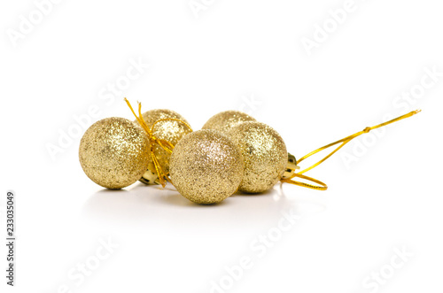 Christmas toys golden balls on a white background. Isolation