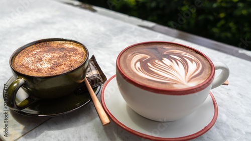 Cappuccino and Mocha on a stone table in a coffee shop in Thailand