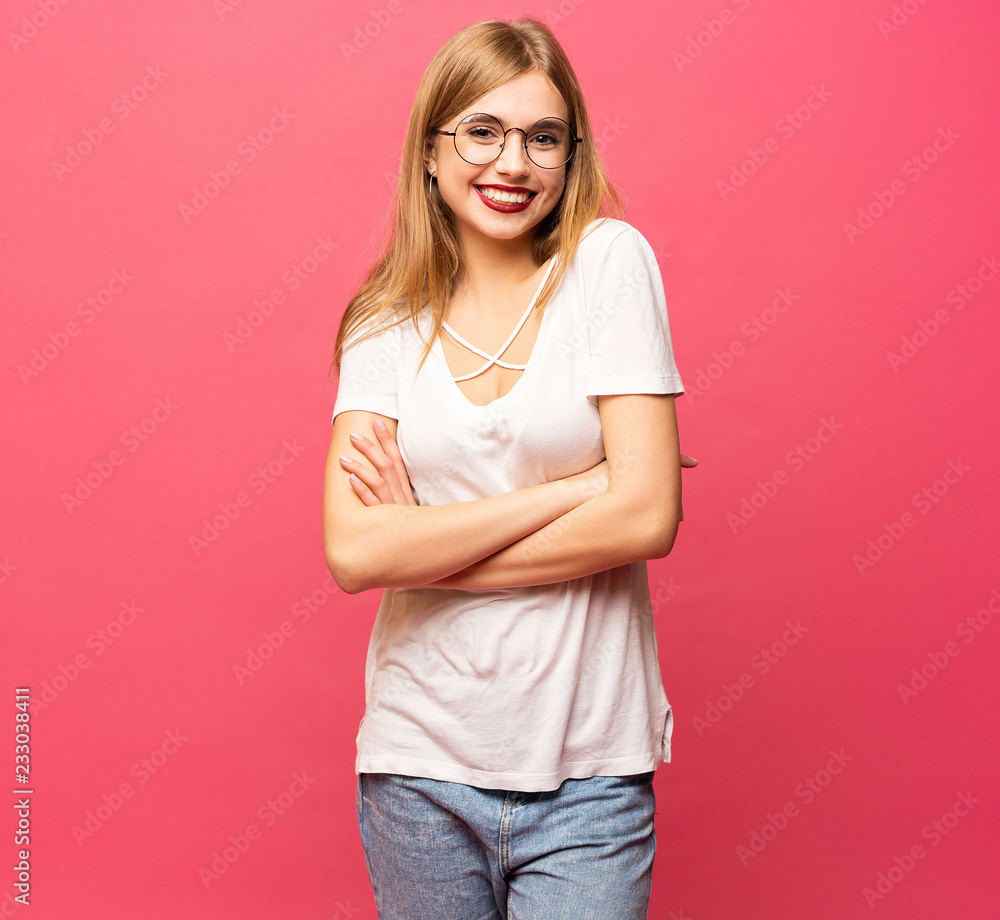 Image of happy young woman standing isolated over pink background. Looking camera pointing. Image of happy young woman standing isolated over pink background. Looking camera pointing.