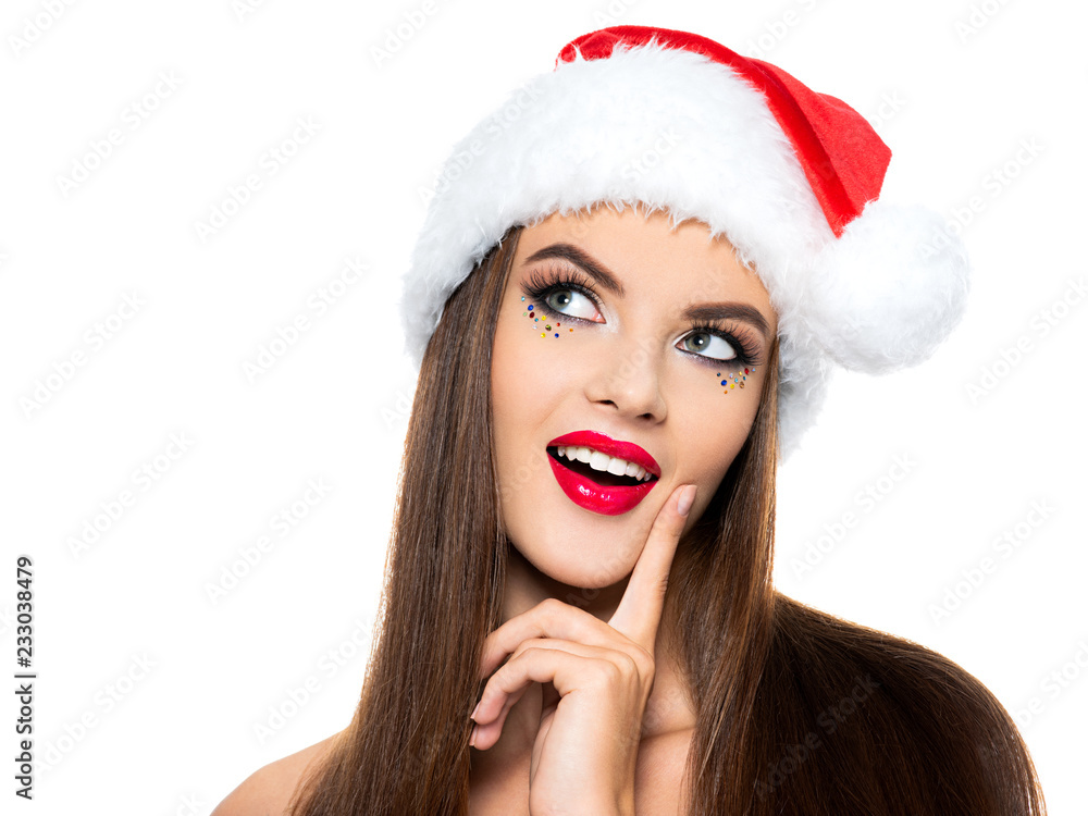 Thinking woman in a santa hat. Thinking woman in a santa hat.