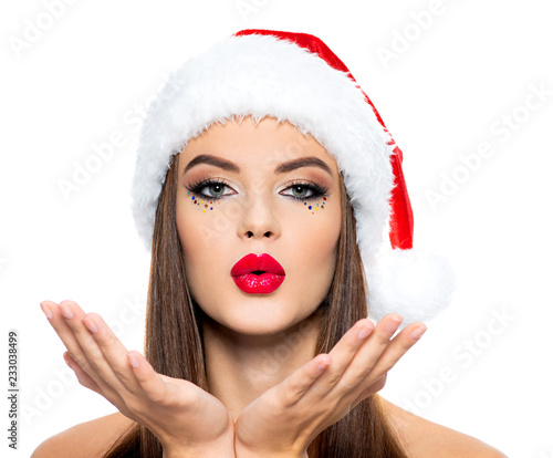 Thinking  woman in a santa hat.