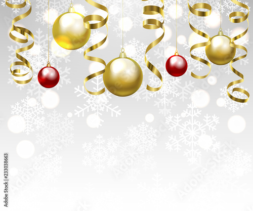 Christmas baubles and golden serpentine streamers. Christmas card