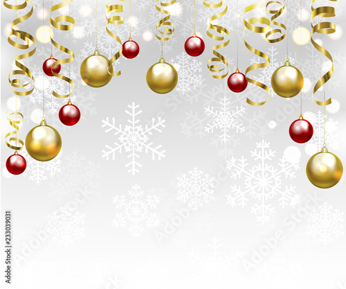 Christmas baubles and golden serpentine streamers. Christmas card