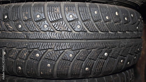 Closeup protector of used winter studded tires - wheel service