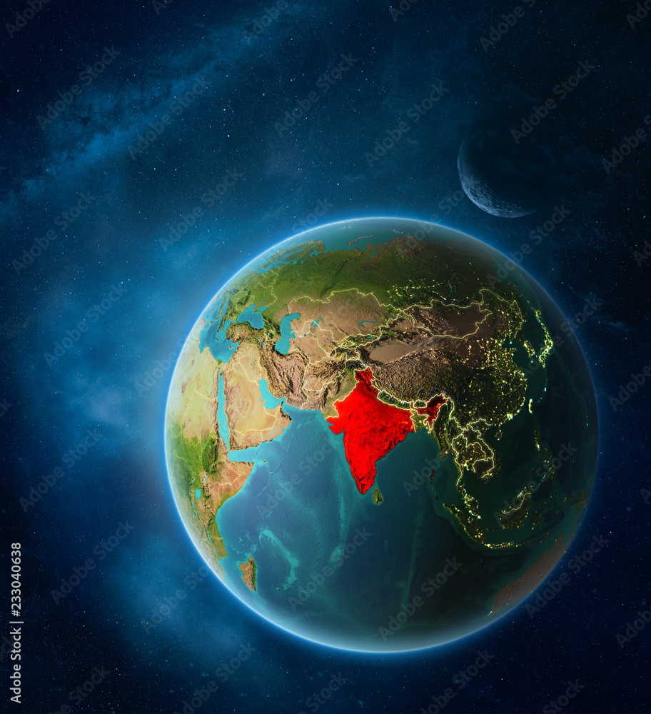 Planet Earth with highlighted India in space with Moon and Milky Way. Visible city lights and country borders.