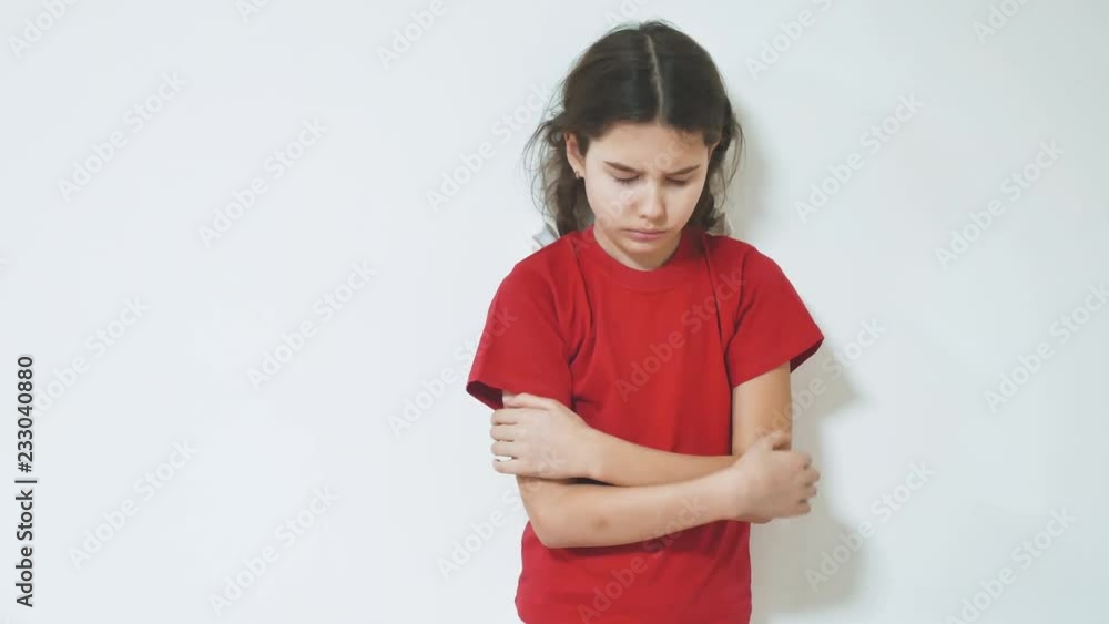 sad and depressed little girl standing by the wall. girl children sad emotions. little girl experiencing lifestyle suffering concept sad and depressed little girl standing by the wall. girl children sad emotions. little girl experiencing lifestyle suffering concept