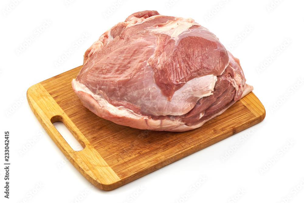 Uncooked ham or gammon on a cutting board, isolated on a white background. Close-up Uncooked ham or gammon on a cutting board, isolated on a white background. Close-up