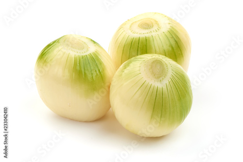 Fresh bulbs of onion  cleared  isolated on a white background. Close-up