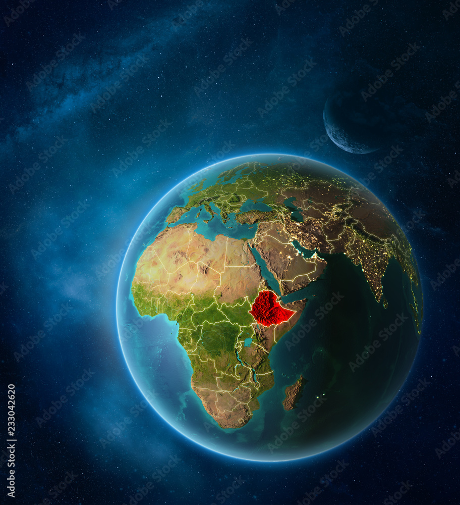 Planet Earth with highlighted Ethiopia in space with Moon and Milky Way. Visible city lights and country borders.