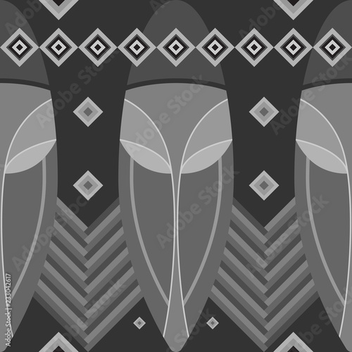 Seamless pattern black and white. Undiscovered Africa. Ethnic pattern stylized African tribal masks inspired by aboriginal Arts. Seamless pattern, geometric ornaments, ritual motifs. photo