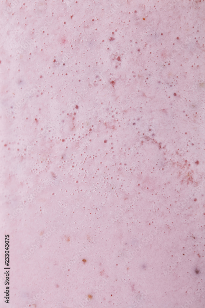 Macro photo of milky berry smoothie with bubbles. Food background Macro photo of milky berry smoothie with bubbles. Food background