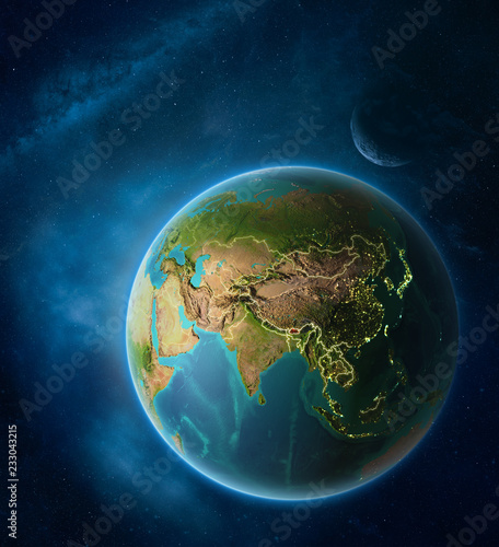 Planet Earth with highlighted Bhutan in space with Moon and Milky Way. Visible city lights and country borders.