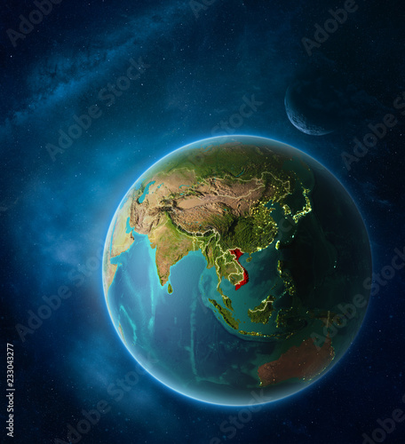 Fototapeta Naklejka Na Ścianę i Meble -  Planet Earth with highlighted Vietnam in space with Moon and Milky Way. Visible city lights and country borders.