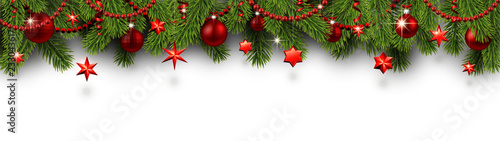 Christmas and New Year banner with fir branches and red Christmas decorations.
