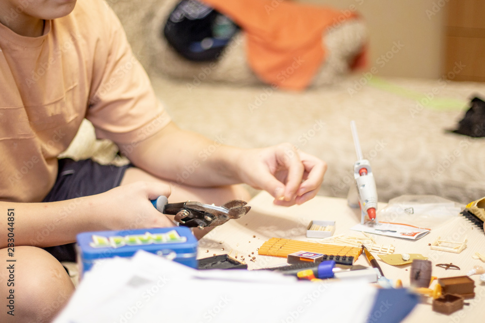 hands of the boy close-up making crafts5.jpg