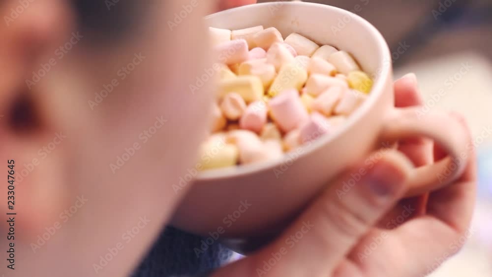 Girl drink chocolate with marshmallows. Close up. Girl drink chocolate with marshmallows. Close up.